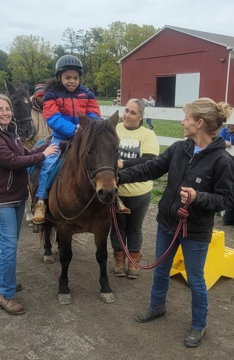 rider and volunteers